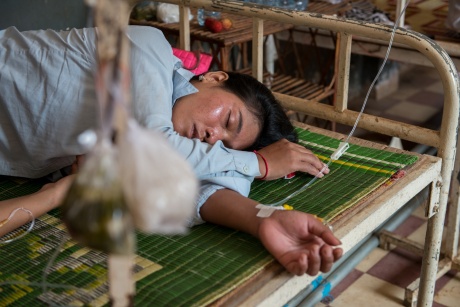 A collapsed garment worker recovers in a clinic outside Phnom Penh. ©IndustriALL Global Union/Luc Forsyth