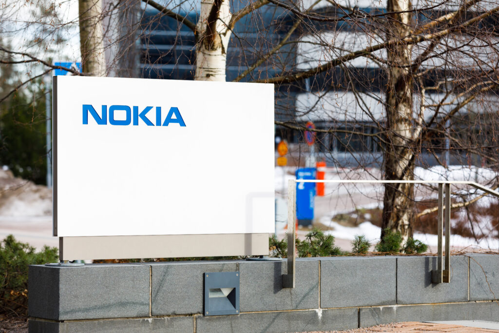 Nokia company name on white board next to Nokia head quarter entrance in Espoo, Finland, Credit: Risto H (Shutterstock)