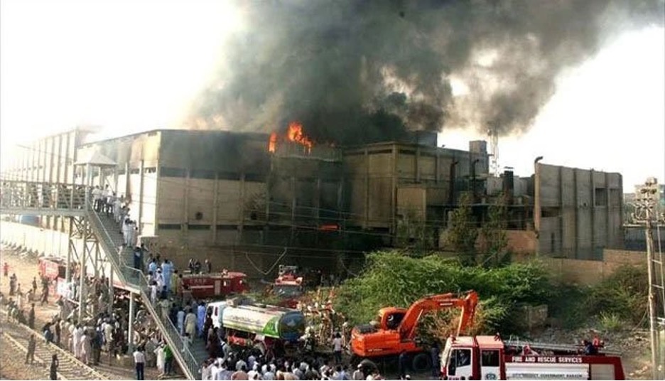 Rescue workers save people from a building fire in Pakistan