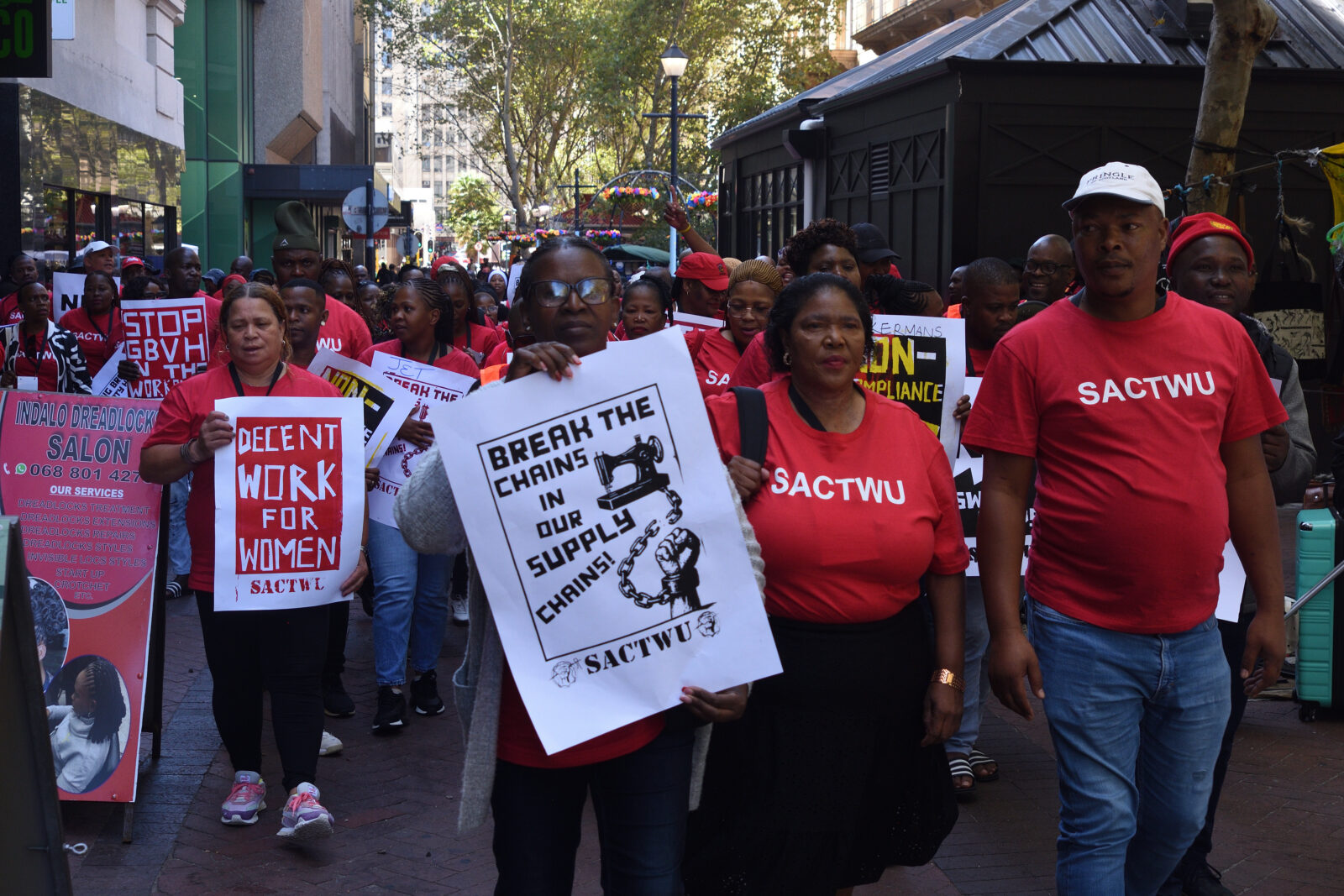 SACTWU workers marching with Break the Chains and Stop GBVH signs in Cape Town, March 2026