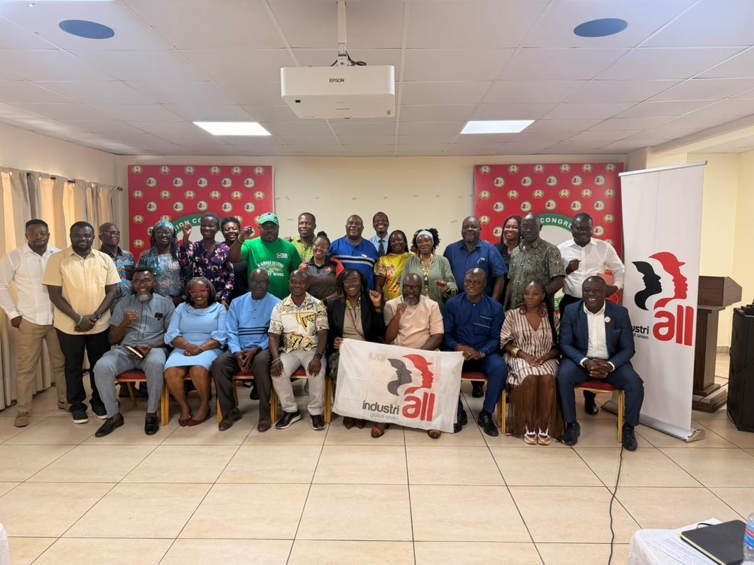 Group photo of approximately 20 trade union and civil society participants at the AGN-IndustriALL just transition meeting in Accra, Ghana, with an IndustriALL Global Union banner held in the foreground