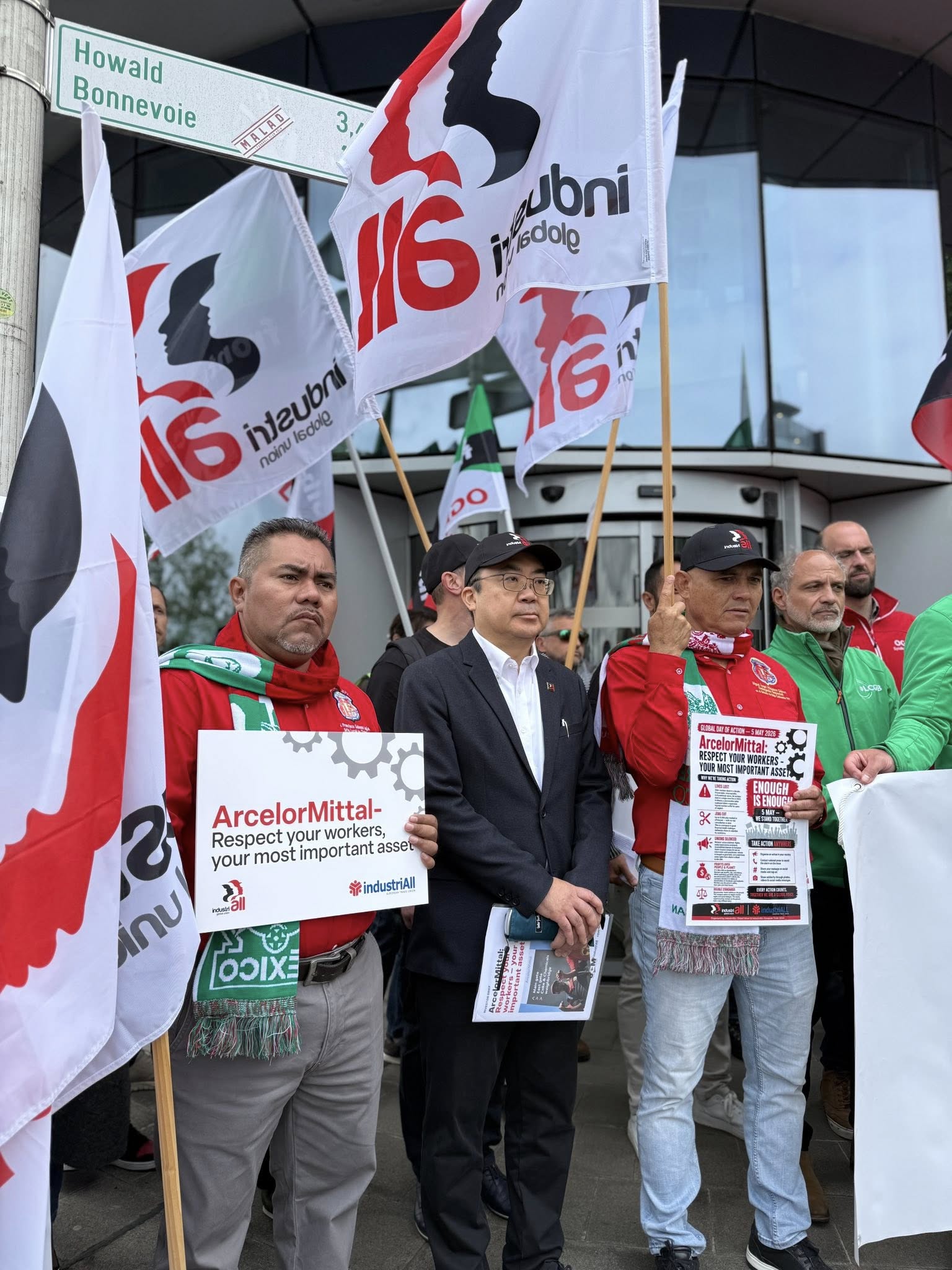 Union representatives and steel workers holding IndustriALL flags and placards outside ArcelorMittal headquarters in Luxembourg during a demonstration at the company's AGM on 5 May 2026.