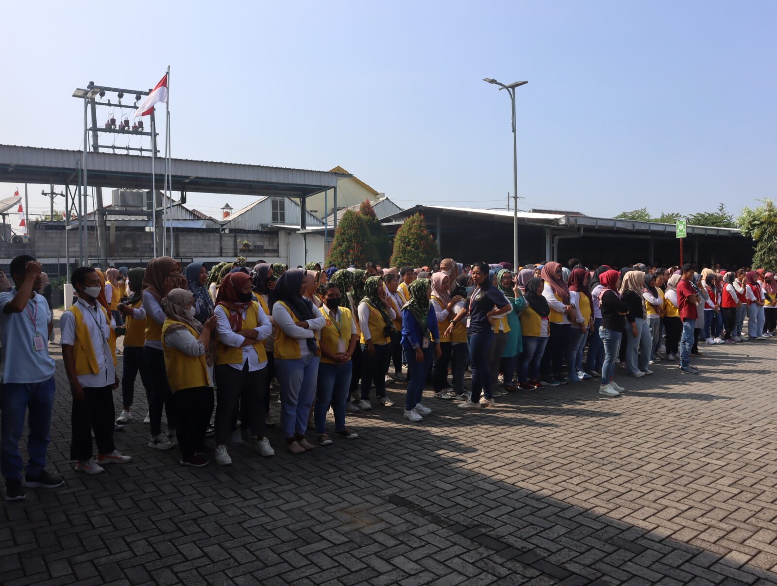 A large group of workers gathered together in Boyolali, Indonesia. Shutterstock