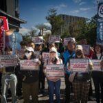 TTLU members and allies rally outside a government building in Taipei, calling on the Philippine representative office and labour officials to stand with Filipino workers at TaiDoc.
