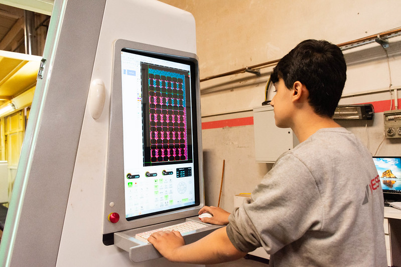 young industrial worker operating a computerised control panel in a factory in Gaziantep, Türkiye