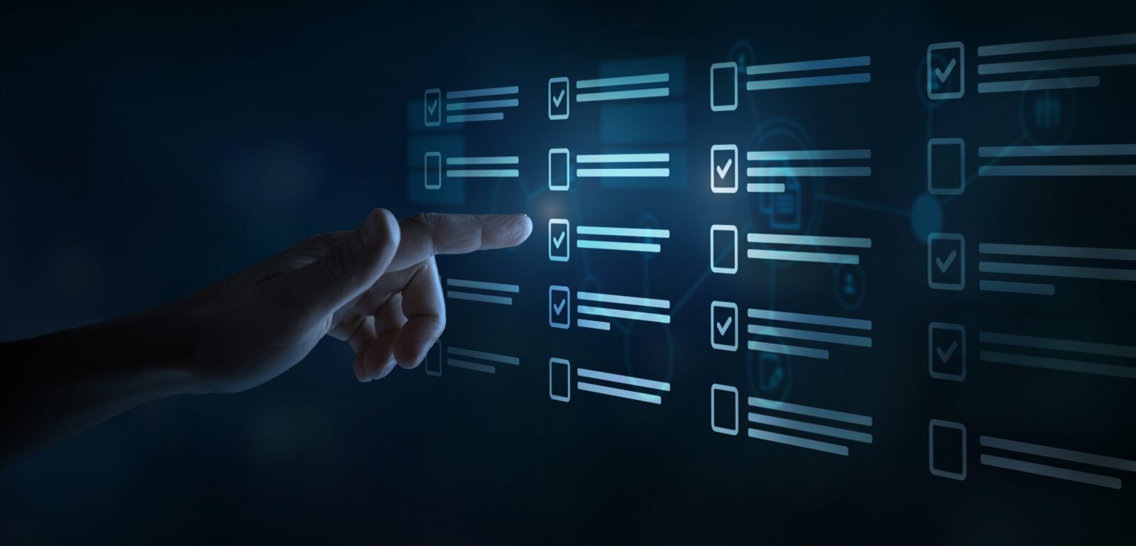 Hand pointing at a digital screen showing checklist items with checkmarks