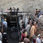 Crowd gathers at Pakistan mine entrance after accident: Photo: Banaras Khan/AFP