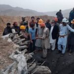 Mine workers and officials meet at a mine site in Pakistan. Photo: Mazhar Chandio/Anadolu/picture alliance