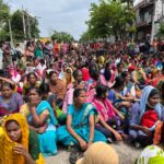 More than 2,000 women garment workers sit in protest against changes to their pension and provident fund rules in Karnataka, India.