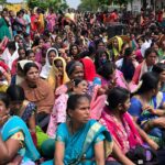 More than 2,000 women garment workers sit in protest against changes to their pension and provident fund rules in Karnataka, India.