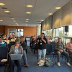 Participants discuss organizing at the battery supply chain conference in Bratislava