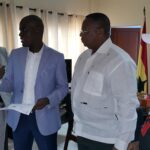 Union leaders hand the petition against precarious work to Ghana's Minister of Labour