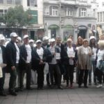 Demonstrators wore T-shirts with the slogan STOP capital greed on 7 October.