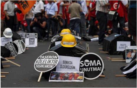 Mock coffins and helmets during a demonstration in Istanbul, May 2014, blaming the government for the Soma disaster. Photo credit REUTERS