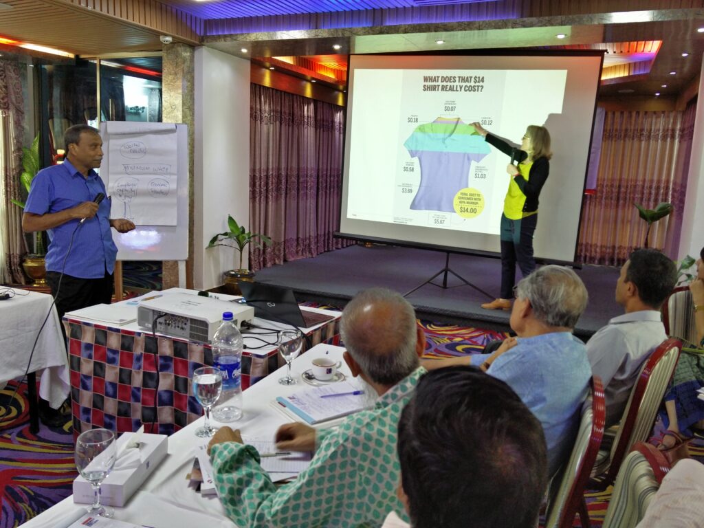 Jenny Holdcroft, IndustriALL policy director, demonstrating the economics of the garment sector