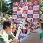 Акция протеста бразильских профсоюзов во время церемонии несения факела