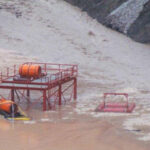 Submerged equipment after heavy rains caused a landslide.