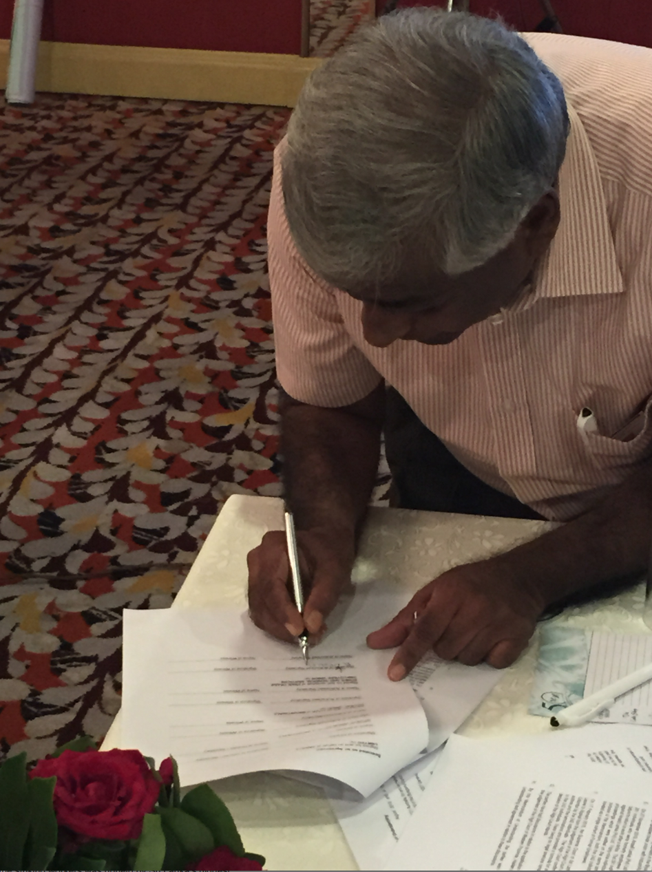 FTZGSEU Joint Secretary Anton Marcus signing the MoU