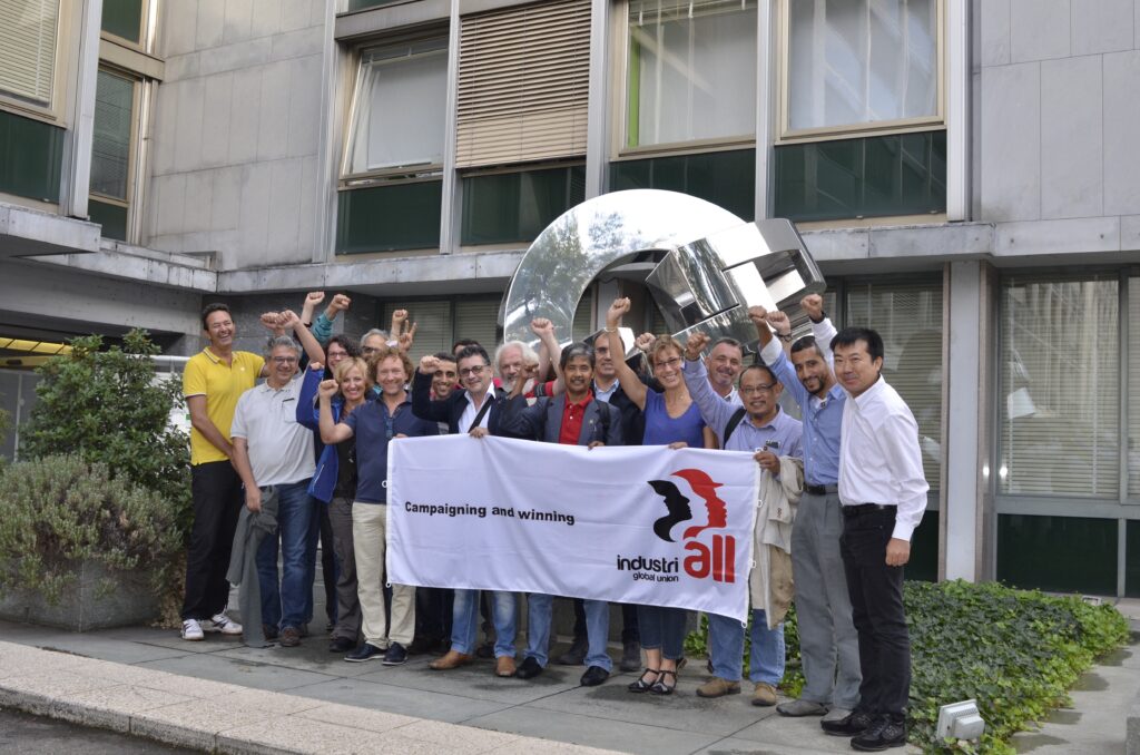 STMicroelectronics union representatives in front of the International Solidarity sculpture at IndustriALL's Geneva headquarters