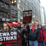 Striking Verizon workers march through New York City