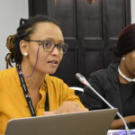 Asanda Benya speaks at the meeting