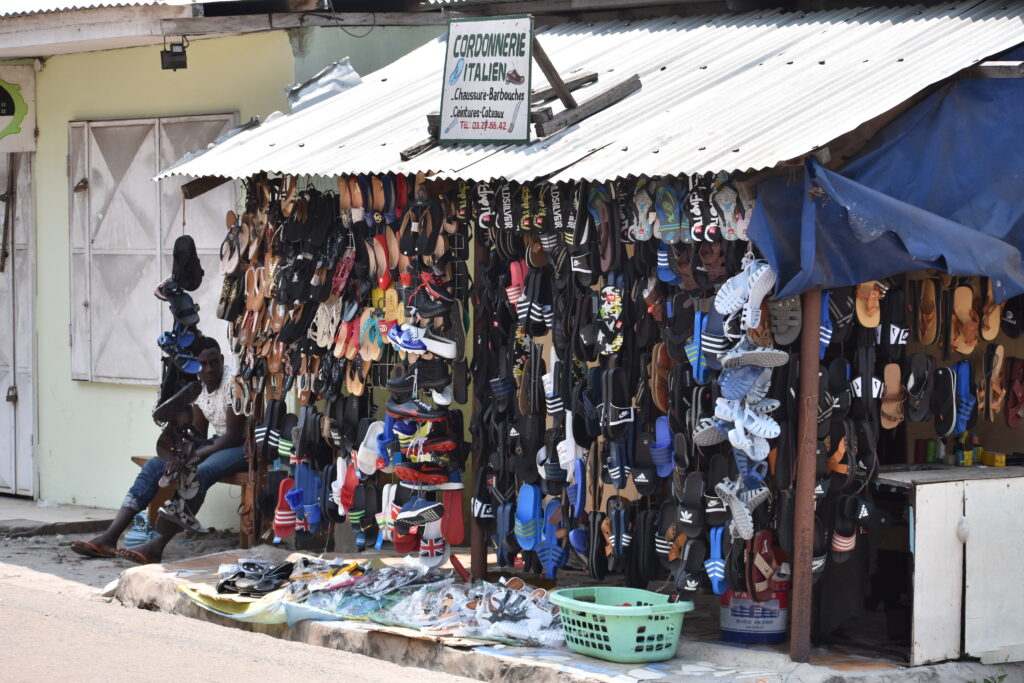 Repairing and selling shoes in Port-Gentil, Gabon