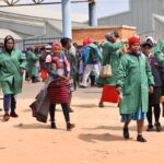 Workers leave a factory during a lunch break at Nhlangano, Swaziland