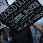 A sign on the L-D239 picket line at Imerys Talc.