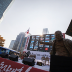 At one of the dispersed rallies in Seoul, a statue of CHUN, Tae-il holding a book labeled the “Three CHUN, Tae-il Laws” 