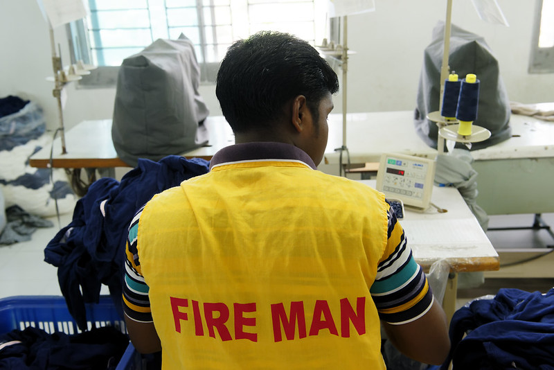 A garment worker who serves as factory-level fire safety facilitator is seen during his shift in a local clothing plant in Bangladesh Photo : Marcel Crozet / ILO