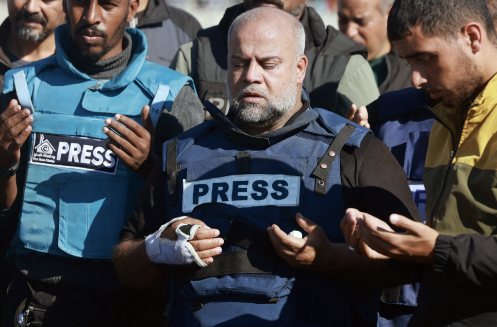 Al Jazeera's bureau chief in Gaza, Wael Al-Dahdouh prays during the funeral of his son Hamza Wael Dahdouh, a journalist with the Al Jazeera television network, who was killed in a reported Israeli air strike in Rafah in the Gaza Strip on January 7, 2024. Credit: AFP.