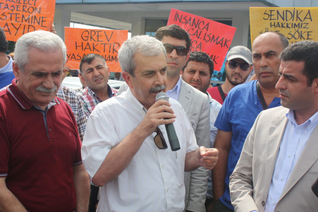 Mr. Selahattin Demirtaş, one of three presidential candidates, joining protestors outside the plant gate.