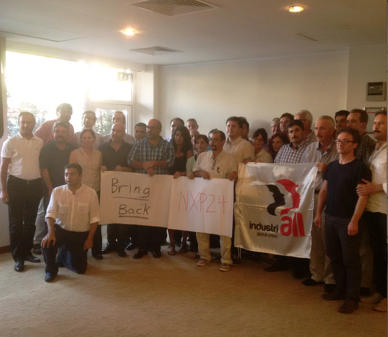 Participants at the workshop showing support for the workers at NXP, Phillipines.