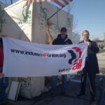 USW Local 7-1 President Dave Denko holding IndustrALL banner with Brian Kohler