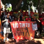 Demonstraters gathering before rally against Rio Tinto