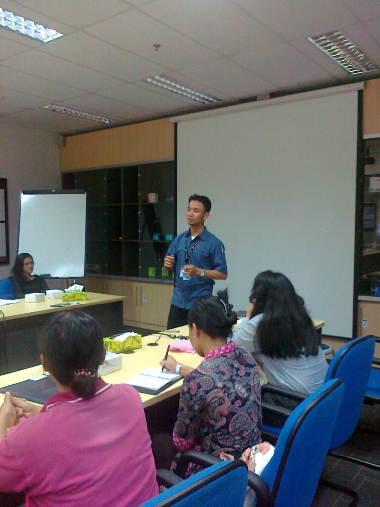 The President of SPKCI giving a presentation during a collective bargaining session.