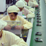 Assembly lines for mobile phones in China. SOMO