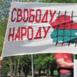 May Day rally 2018, REP activists hold the banner “Freedom to people”.