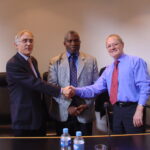 Fred Higgs (right) retiring as general secretary of ICEM and handing over the mantel to Manfred Warda (right) in 2006, watched by ICEM President Senzeni Zokwana. 