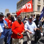Fred Higgs (centre right) marching through Durban, South Africa, with Senzeni Zokwana immediately after his first election as ICEM general secretary in 1999