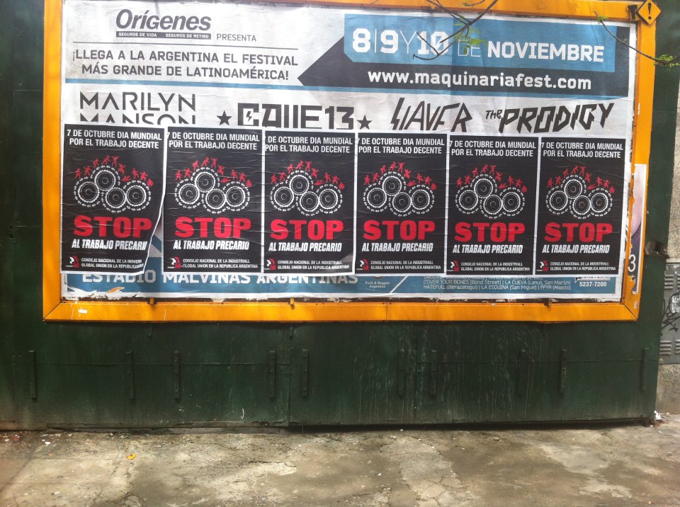 Buenos Aires, walls plastered with Stop Precarious Work posters