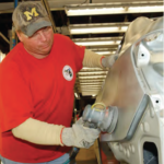 GM worker Kenneth Tracy Jr. at work in the metal finish section of the body shop. He is a member of UAW Local 5960 in Lake Orion, Michigan