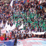 30,000 workers rally in Jakarta for an increased minimum wage and access to the general health insurance promised by the government